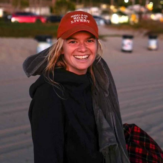 Headshot of Addie on the beach.